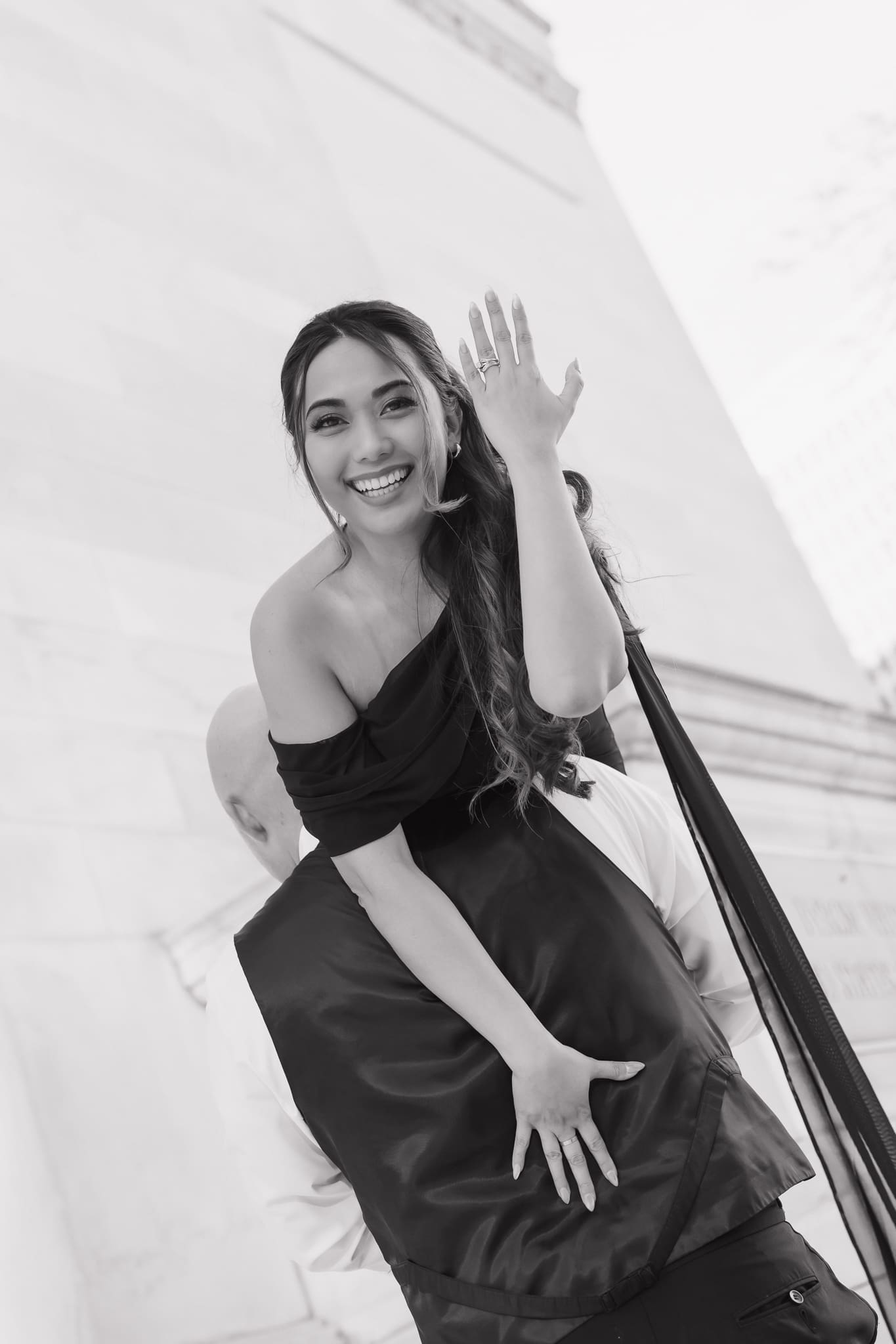 Black and white bridal portrait showing off engagement ring 