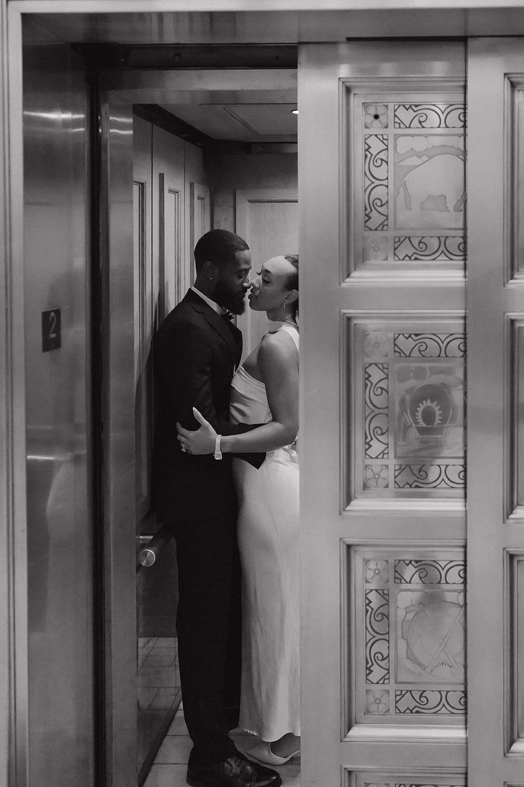 Black and white courthouse elevator wedding photo in downtown Denver