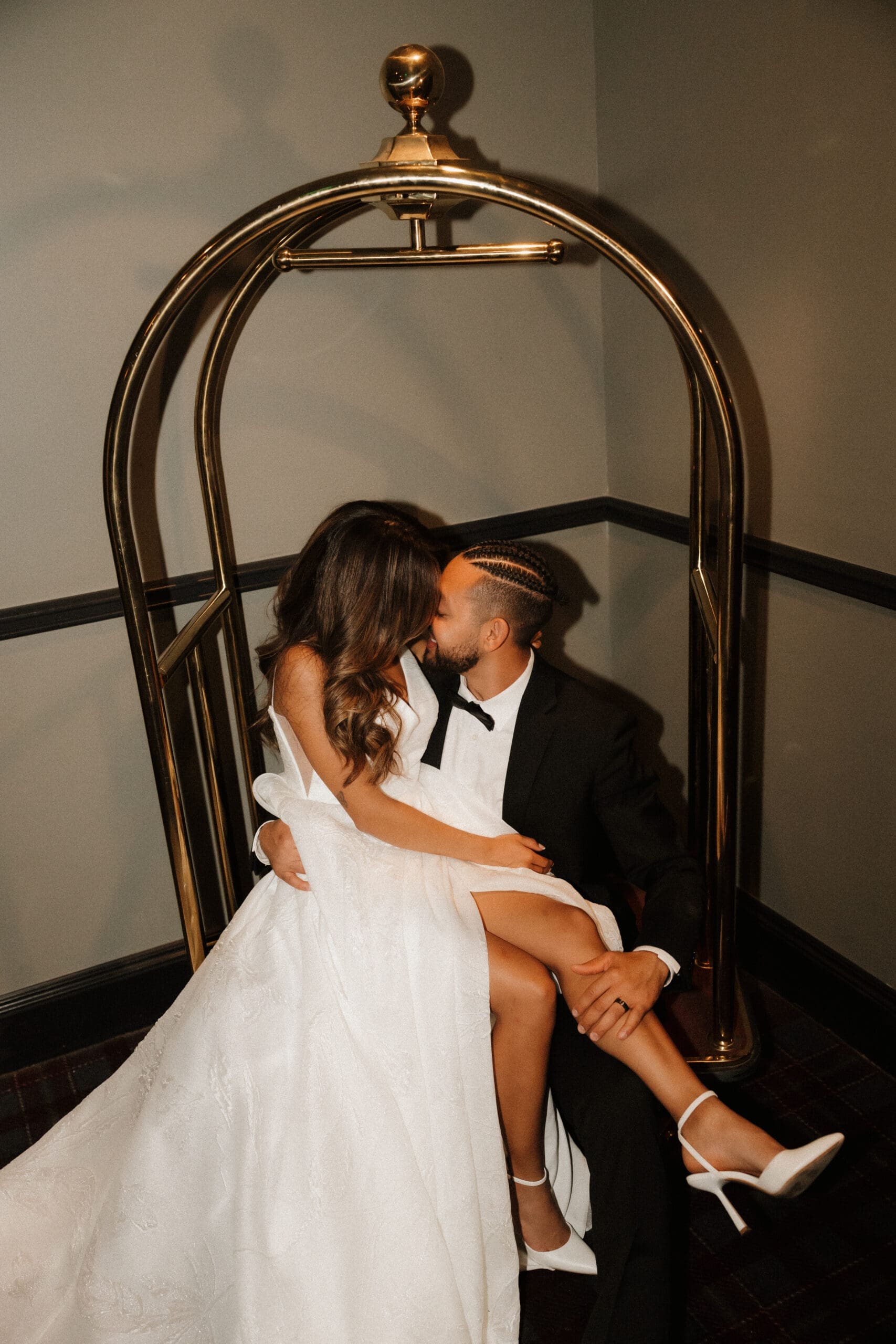 Romantic downtown Denver hotel wedding portraits with bride and groom sharing an intimate moment