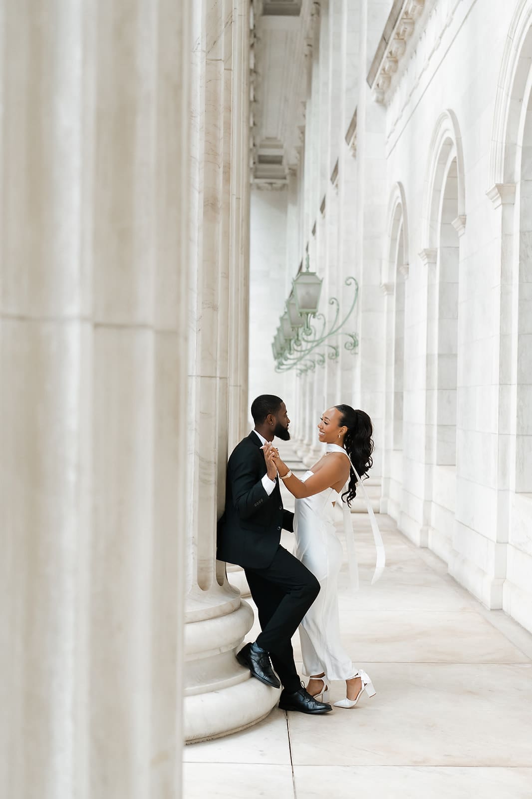 Romantic couple portraits outside the Denver courthouse columns