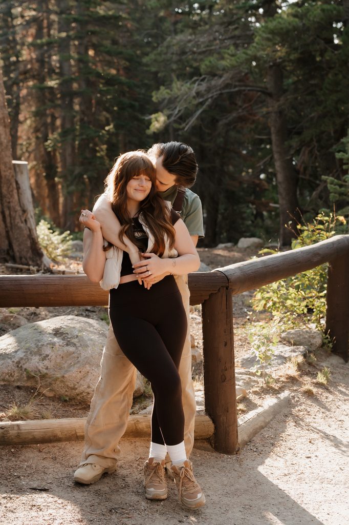 Colorado Engagement Session Locations Couple enjoying a scenic mountain overlook during a Rocky Mountain National Park Colorado engagement session