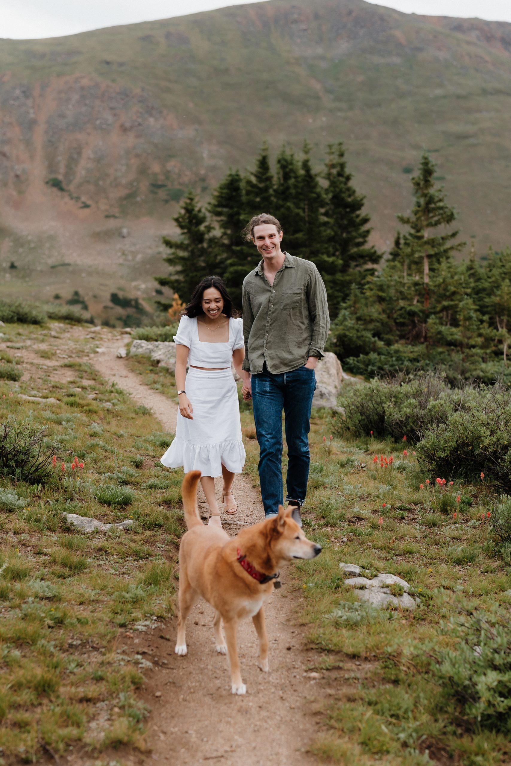 Colorado Engagement Session Locations Engaged couple posing in a scenic alpine field during their Loveland Pass Colorado engagement session